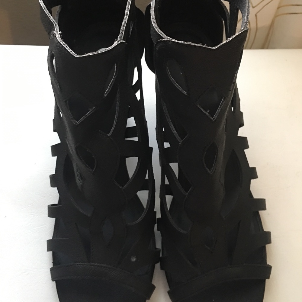 Black strappy wedge heel shoe